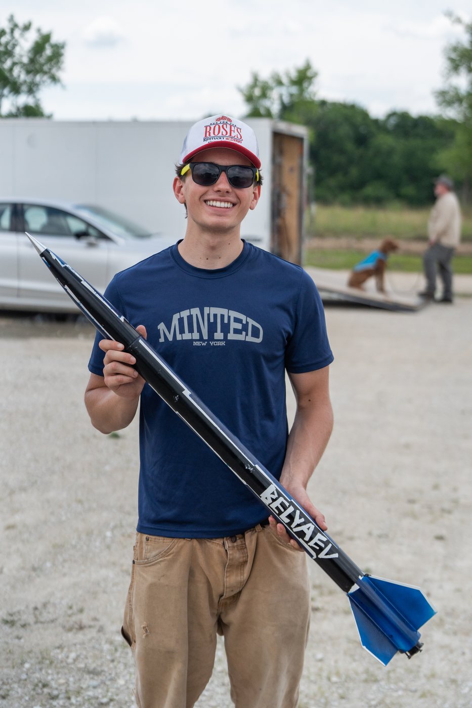 Dominic Belyaev holding his Level 1 certification rocket at the launch site