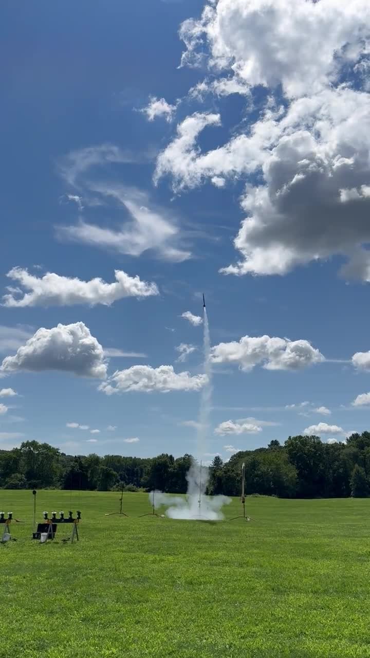 The rocket climbing off the pad trailing a smoke column