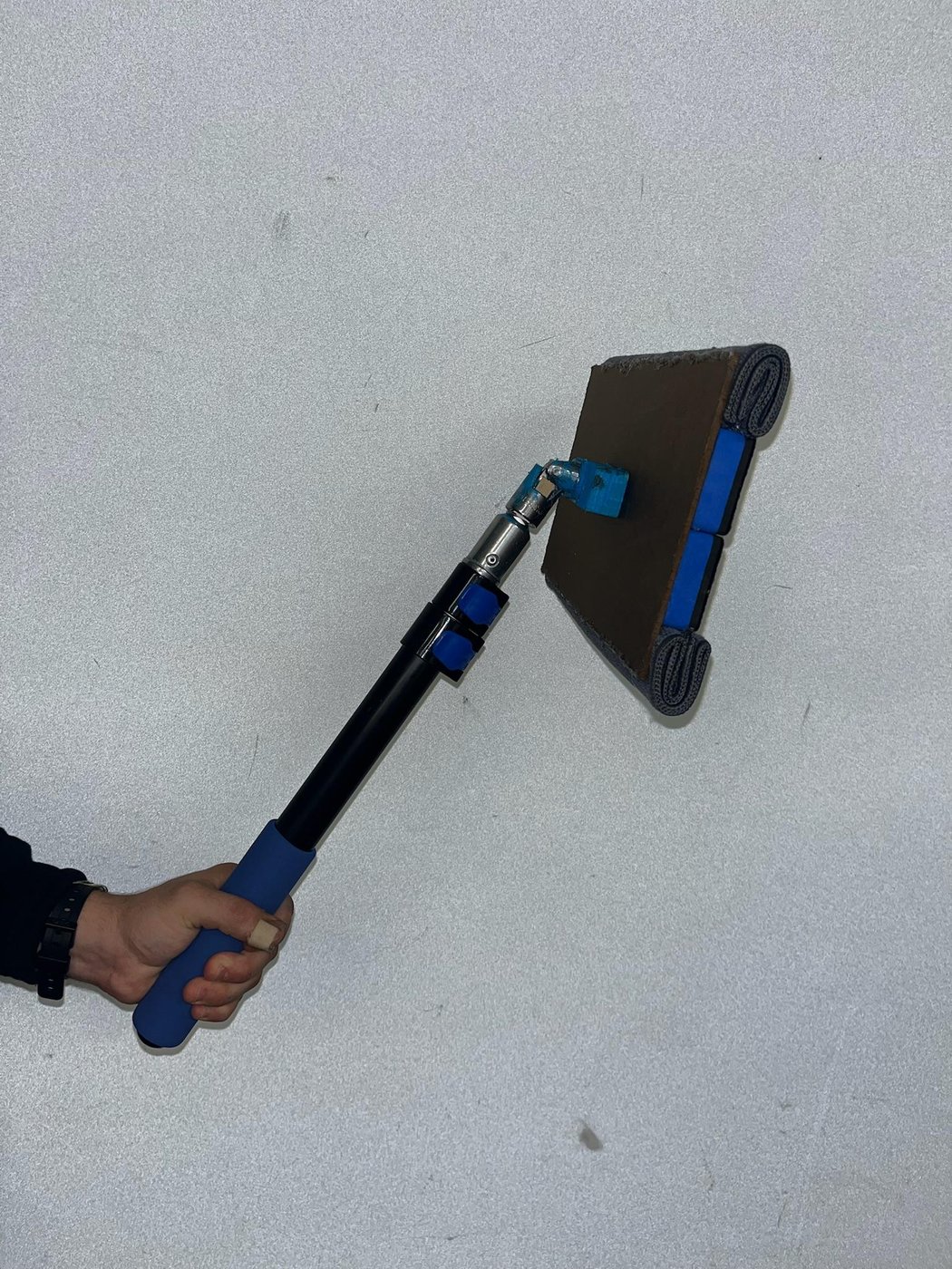 The MagClean magnet-assisted whiteboard eraser in use