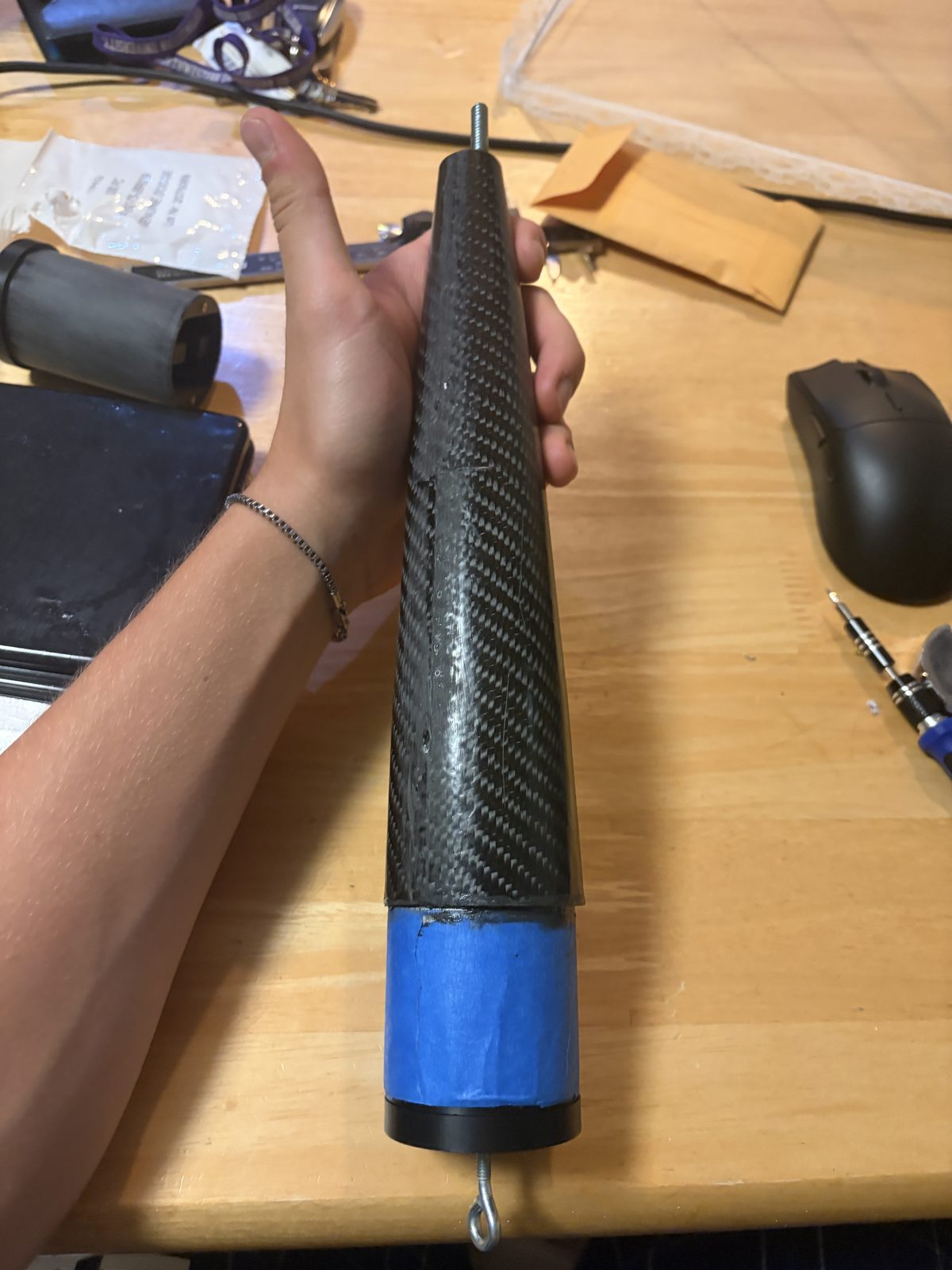 Finished carbon fiber nosecone assembled on its blue printed coupler