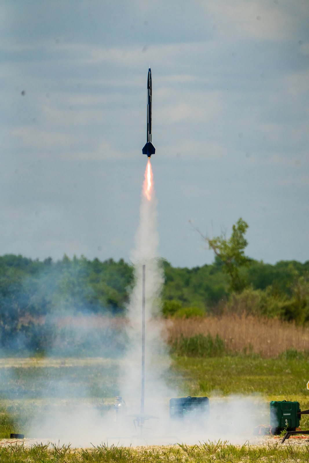 Rocket ascending with flame and smoke column
