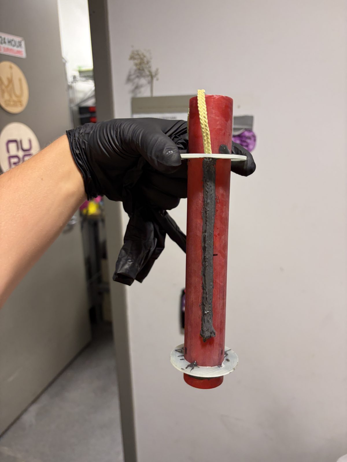 Kevlar shock cord anchored under centering ring with internal epoxy fillet