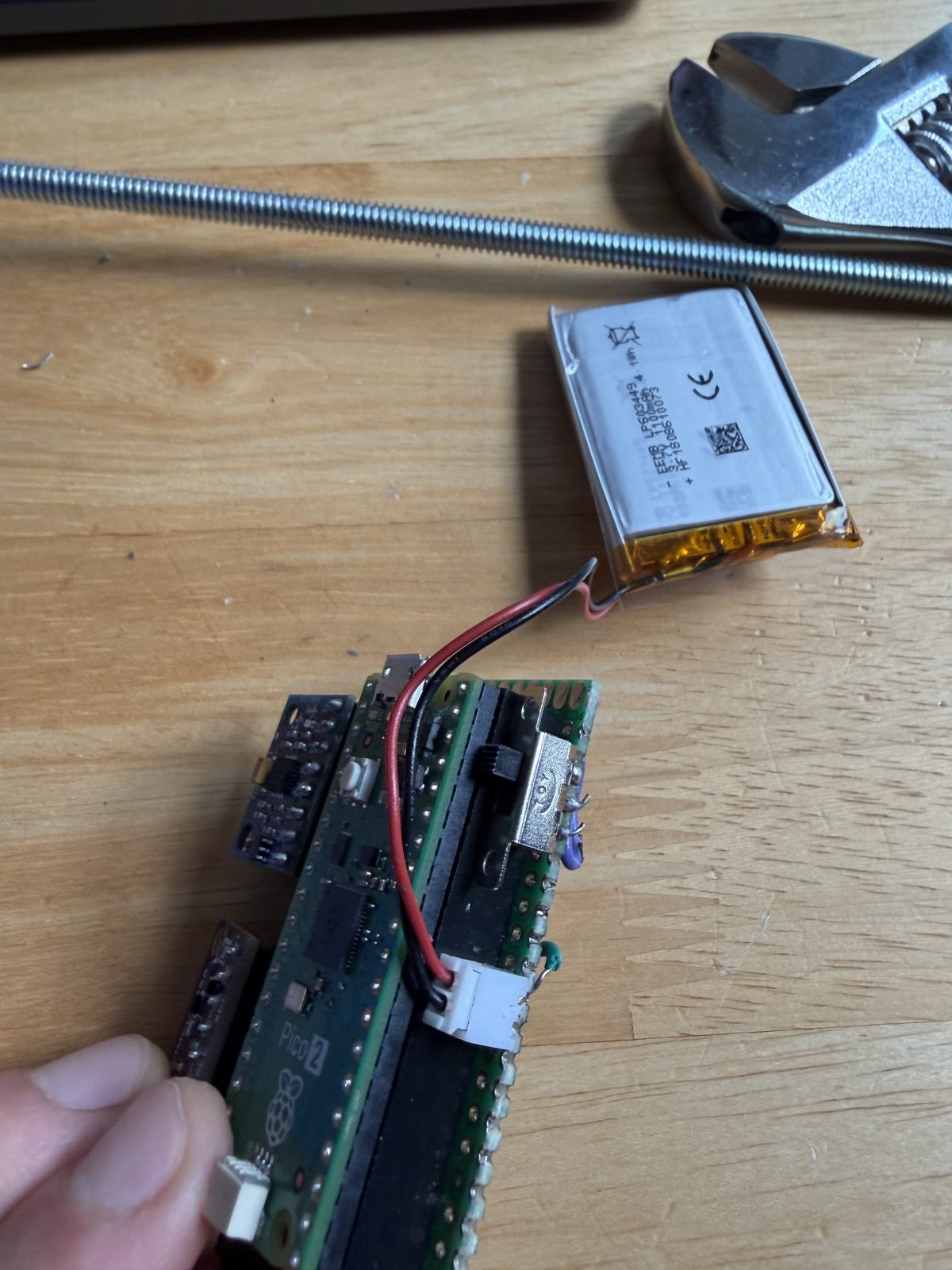 Battery harness with JST connector and arming slide switch wired to the flight board